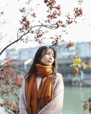 Model wearing a camel cashmere wrap