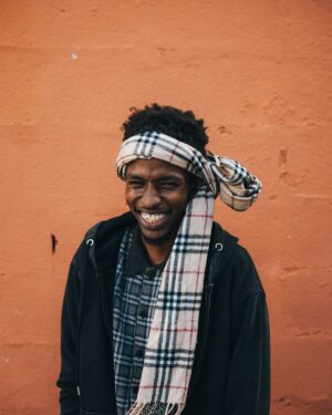 Model wearing a plaid wool-cashmere wrap