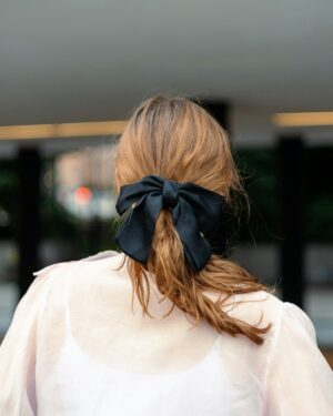 Model wearing a silk hair accessory