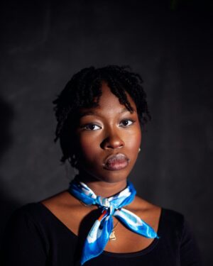 Model wearing a sapphire silk twilly